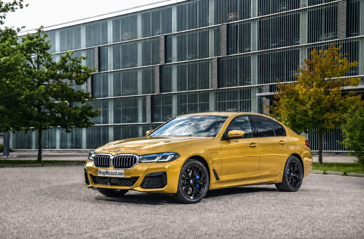 Gloss Gold vinyl wrap on BMW 5 Series