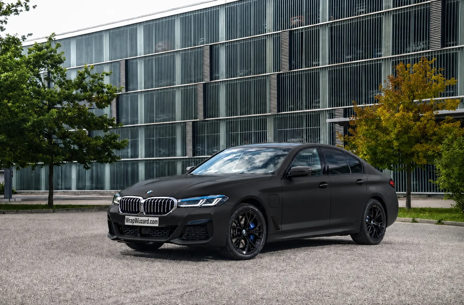 Satin Black vinyl wrap on BMW 5 Series