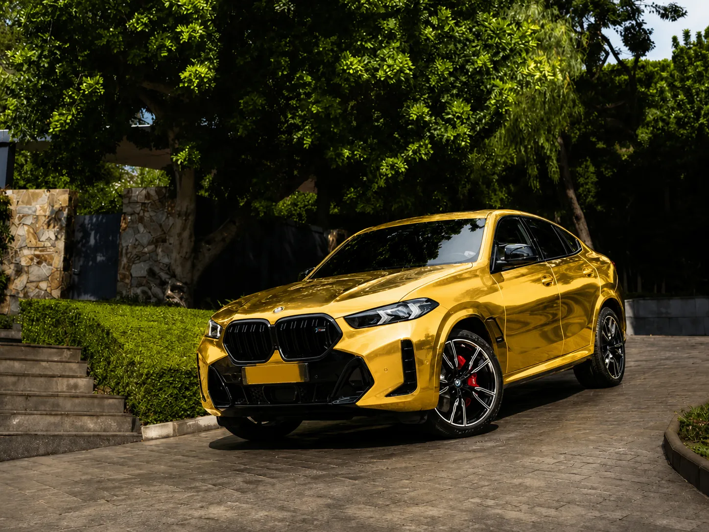 Gloss Gold vinyl wrap on BMW X6