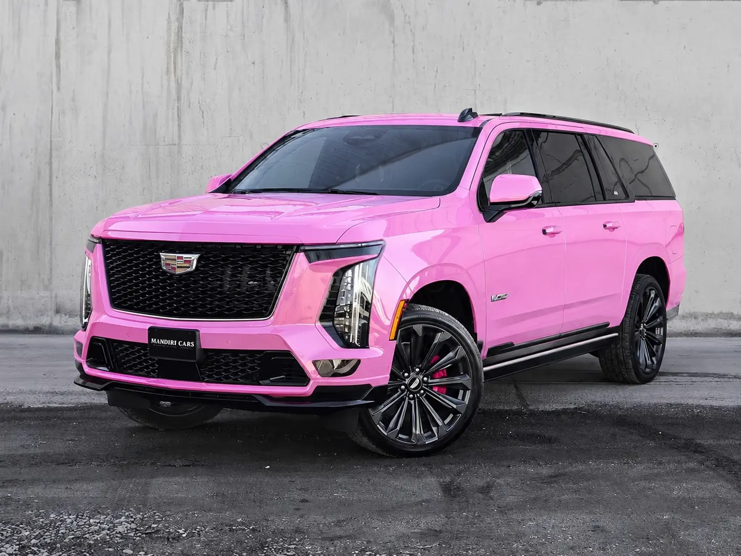 Pink vinyl wrap on Cadillac Escalade