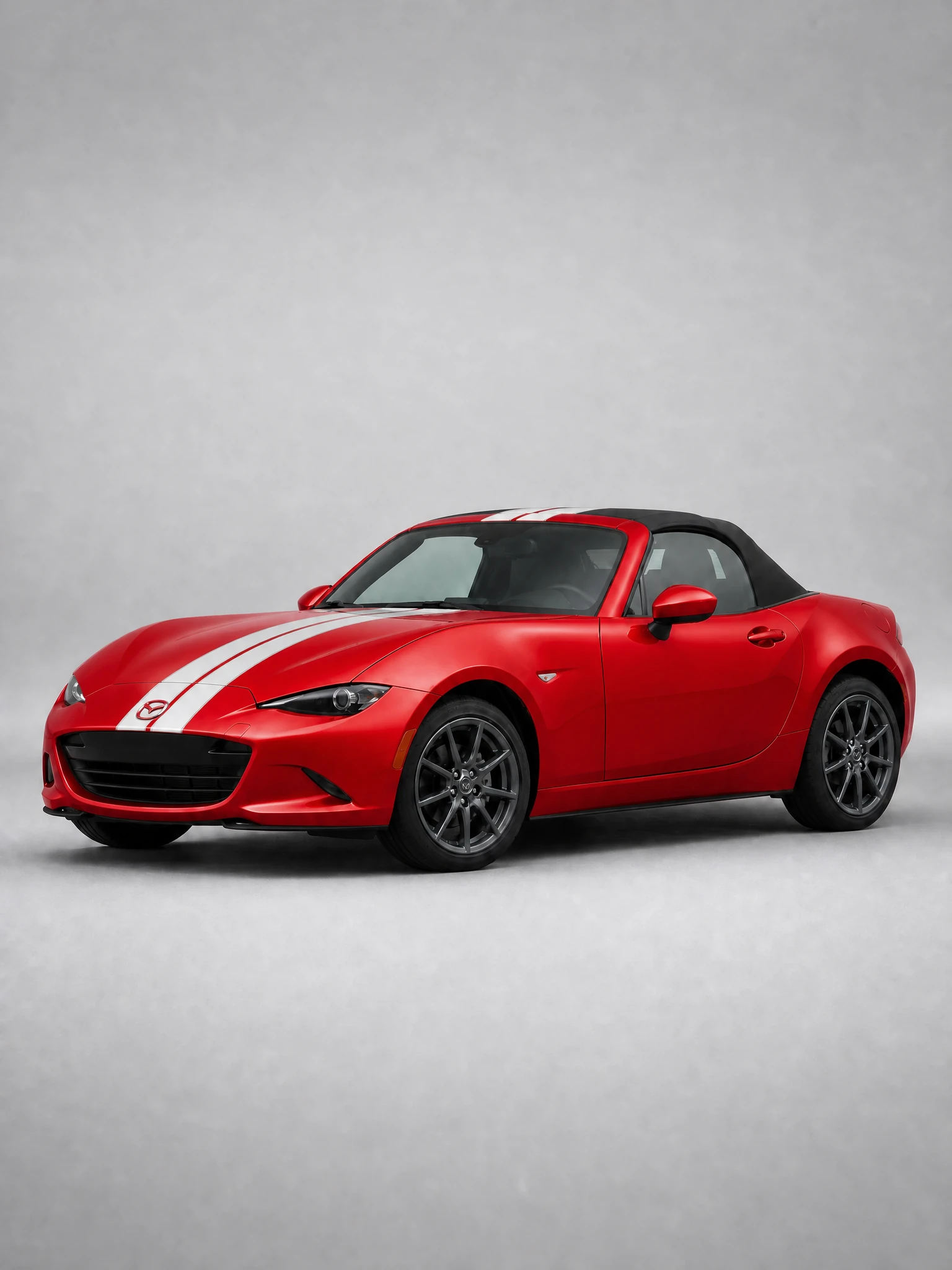 Mazda Miata wrapped in Guards Red with white racing stripes